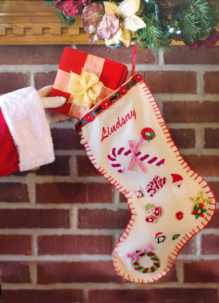 santa putting gift in stocking